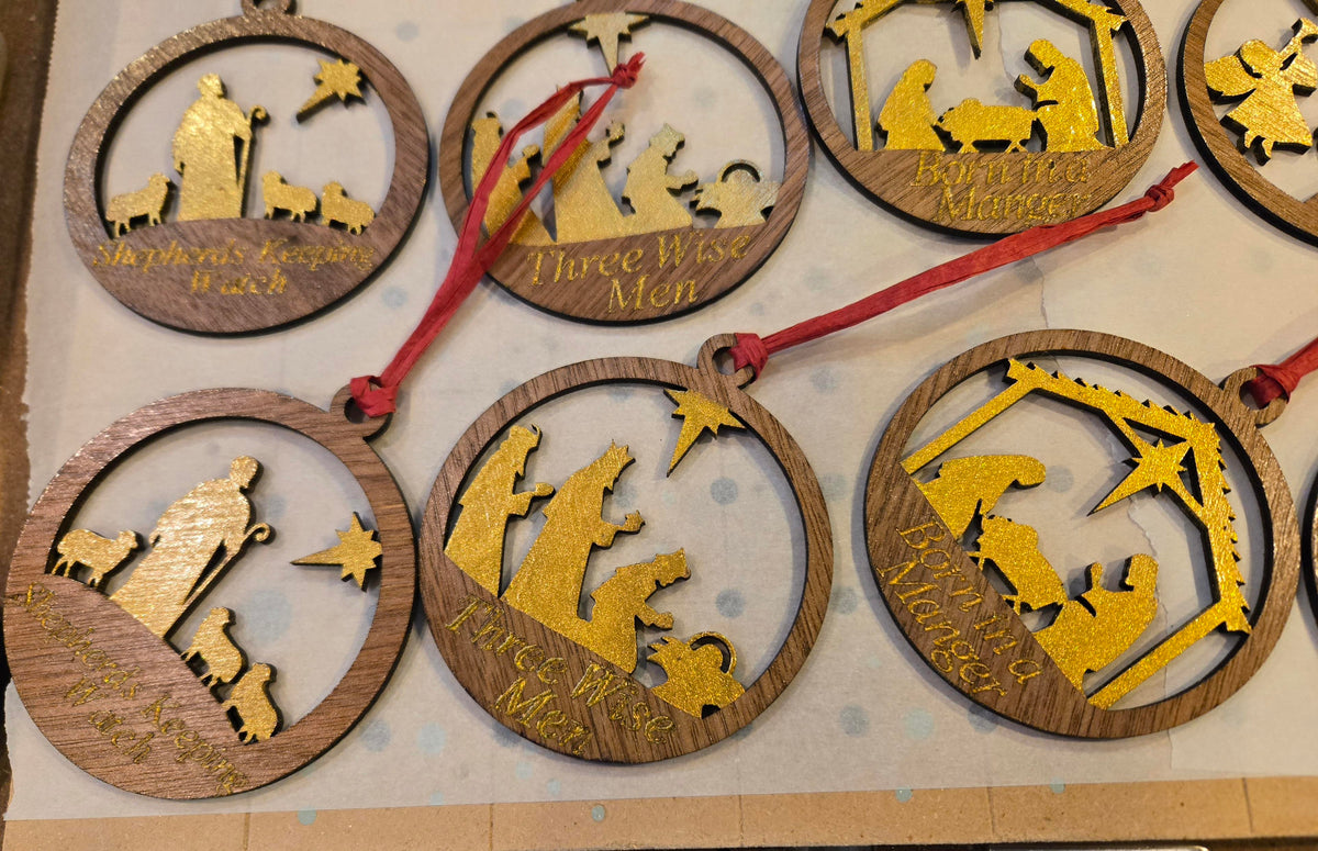 Shepherds Keeping Watch, Three Wise Men, and Born in a Manger ornaments with gold fill details
