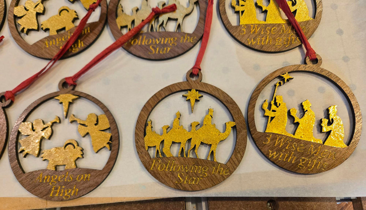 Close-up of Angels on High, Following the Star, and 3 Wise Men with Gifts nativity ornaments with gold fill