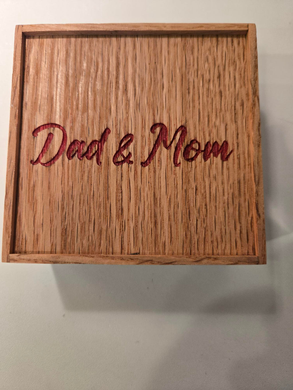 Top view of engraved wood gift box personalized with Dad and Mom