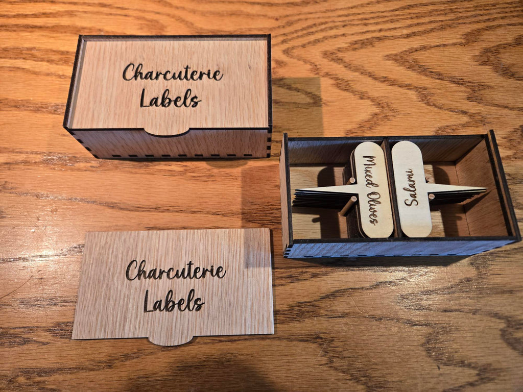Charcuterie label box open showing engraved wooden labels inside