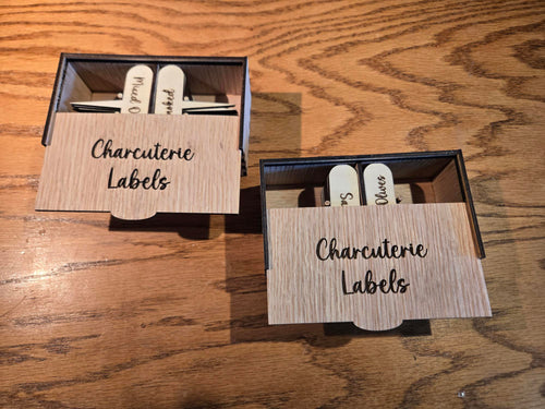 Five laser engraved charcuterie label boxes arranged together